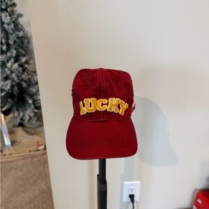 Lucky Brand Red Hat with Classic Baseball Cap Shape and Bright Yellow Logo